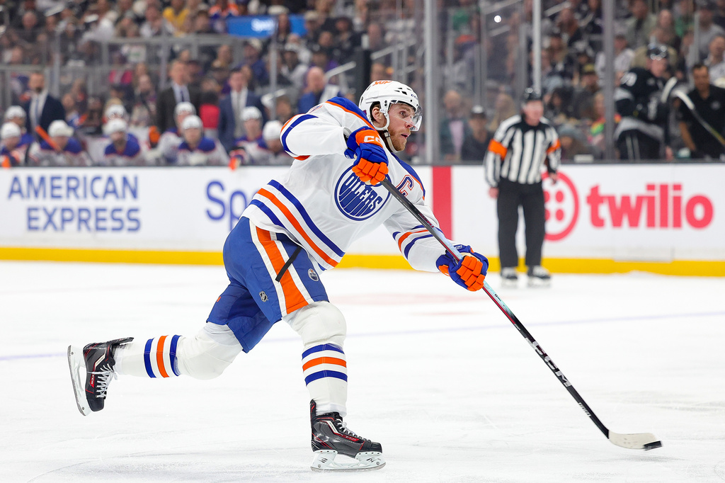 Edmonton Oilers center Connor McDavid shoots during the first period of an NHL hockey game against the Los Angeles Kings, Saturday, April 11, 2026, in Los Angeles. (AP Photo/Ryan Sun)