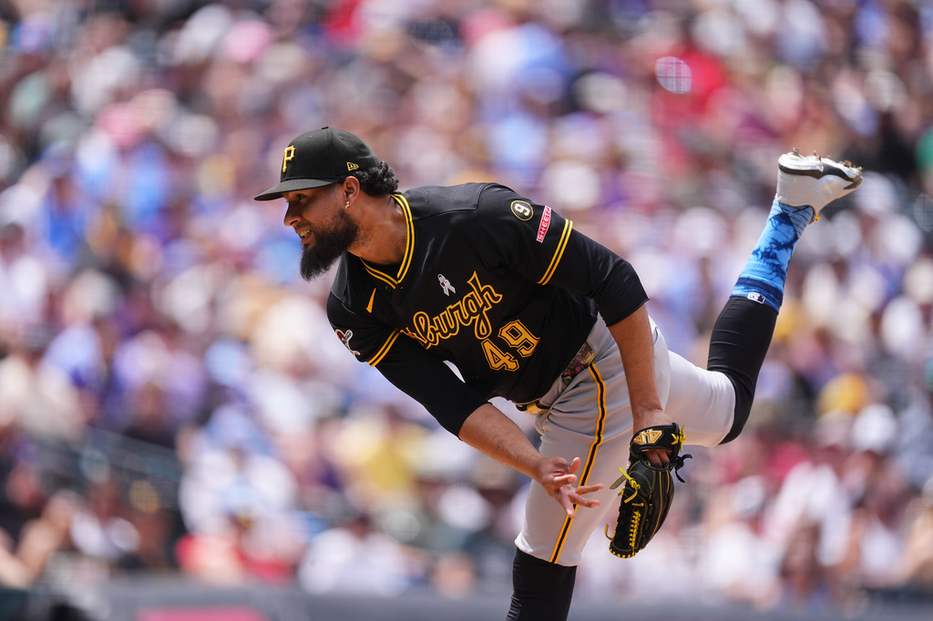 Pittsburgh Pirates relief pitcher Yohan Ramírez works against the Colorado Rockies in the fourth inning of a baseball game Sunday, June 21, 2026, in Denver. (AP Photo/David Zalubowski)