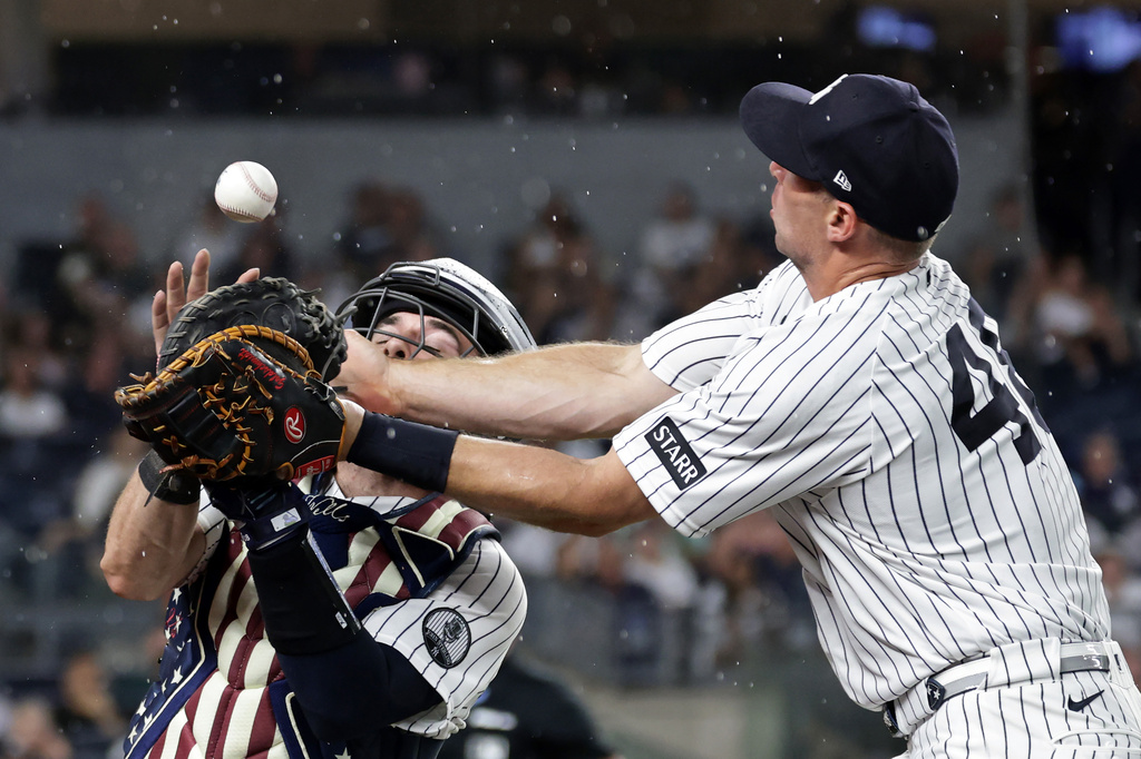 New York Yankees catcher Austin Wells and first baseman Paul Goldschmidt (48) collide and drop a foul ball hit by the Minnesota Twins during the fourth inning of a baseball game Friday, July 3, 2026, in New York. (AP Photo/Adam Hunger)
