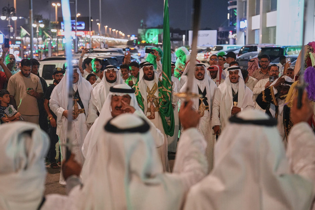 Men perform the traditional Saudi sword dance known as the ardah during celebrations marking Saudi Arabia's 96th National Day in Riyadh, Saudi Arabia, Wednesday, Sept. 23, 2026. (AP Photo/Baraa Anwer)