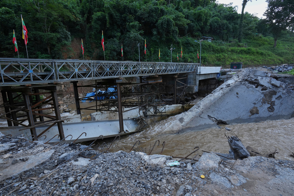 In this photo taken during a trip supervised by pro-military Myanmar media, the damaged Gotwin bridge is seen in Kawnghkio township, northern Shan State, Myanmar, Friday, Oct. 10, 2025. (AP Photo/Aung Shine Oo)