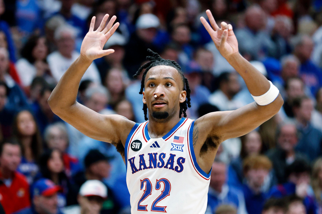 Kansas guard Darryn Peterson signals a play during the first half of an NCAA college basketball game against Houston, Monday, Feb. 23, 2026, in Lawrence, Kan. (AP Photo/Colin E. Braley)