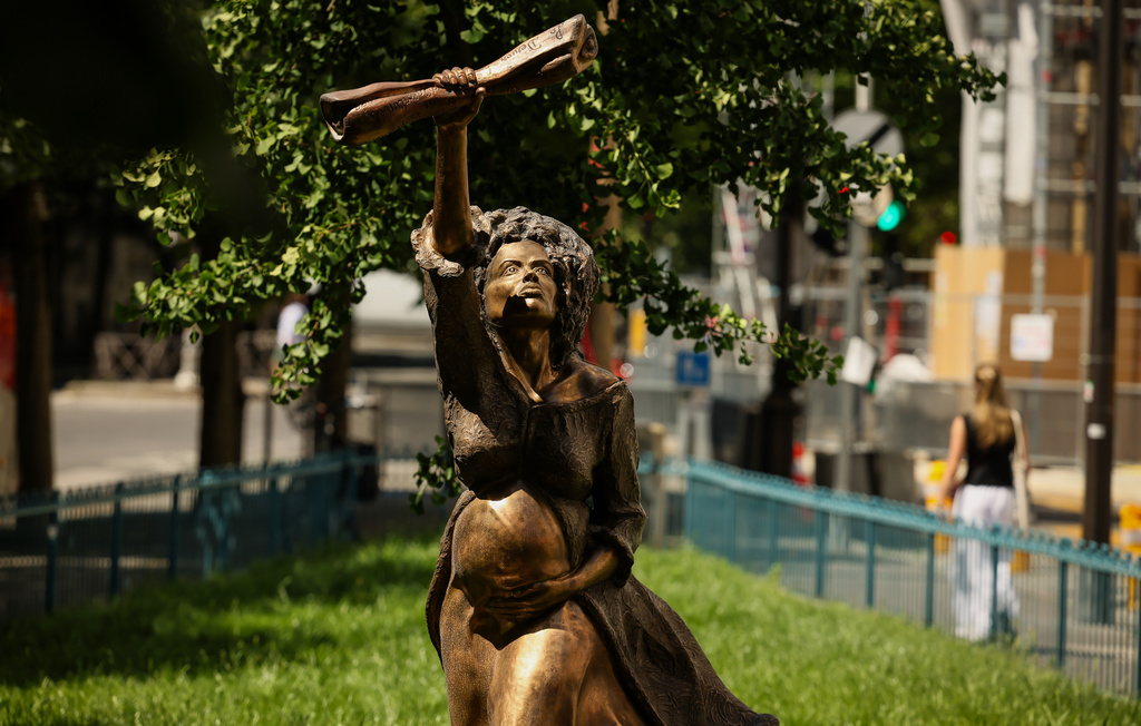 A statue is photographed by French artist Didier Audrat in Paris, Wednesday, May 27, 2026, honoring the memory of the abolition of slavery, depicting Solitude, the daughter of an African slave who was raped by a sailor aboard the ship transporting her to the Caribbean, holding the proclamation of Louis Delgres, an anti-slavery resistance leader calling for resistance and struggle. (AP Photo/Thomas Padilla)