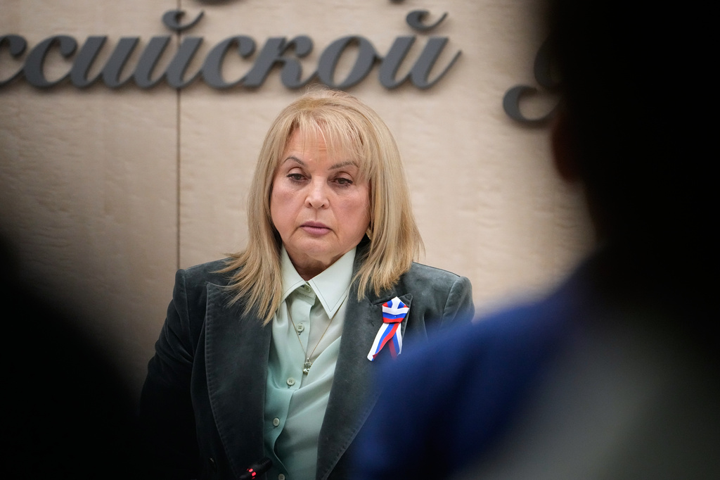 Ella Pamfilova, head of Russia's Central Election Commission, holds a moment of silence in memory of the deceased members of the electoral commissions, during reporting of the official results of Russia's parliamentary elections at the commission's meeting in Moscow, Russia, Friday, Sept. 25, 2026. (AP Photo/Alexander Zemlianichenko)