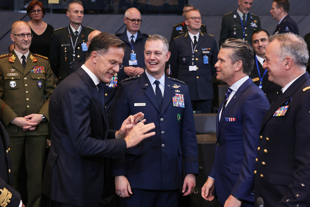 United States Defense Secretary Pete Hegseth, center right, speaks with NATO Secretary General Mark Rutte, center left, and Supreme Allied Commander Europe (SACEUR), General Alexus G. Grynkewich, center, during a meeting of the North Atlantic Council in defense ministers format at NATO headquarters in Brussels, Wednesday, Oct. 15, 2025 (AP Photo/Omar Havana)