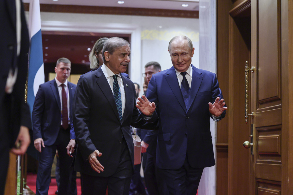 Russian President Vladimir Putin, right, meets with Pakistan's Prime Minister Shehbaz Sharif at Diaoyutai State Guesthouse in Beijing, China, Tuesday, Sept 2, 2025. (Maxim Shemetov/Pool Photo via AP)