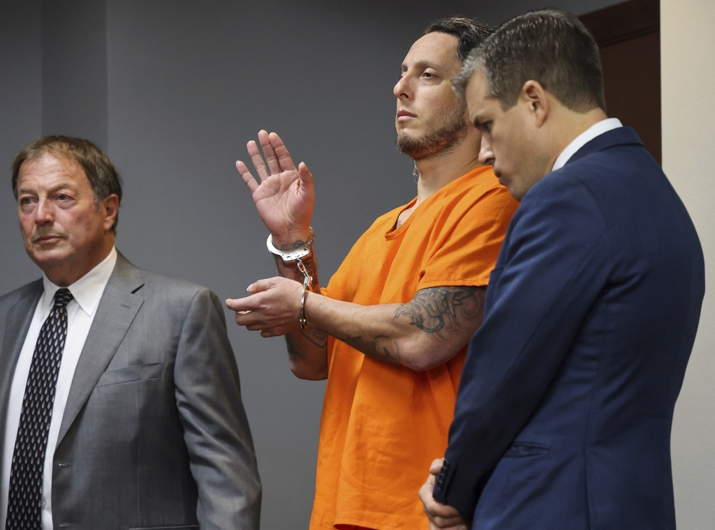 Oscar Olea, center, is sworn-in court prior to Judge Alberto Milian explaining his plea deal while standing next to his attorneys - Charlton Stoner, left, and Matthew Ladd, right, at the Richard E. Gerstein Justice Building on Thursday, Aug. 21, 2025, in Miami, Fla. (Carl Juste/Miami Herald via AP, Pool)