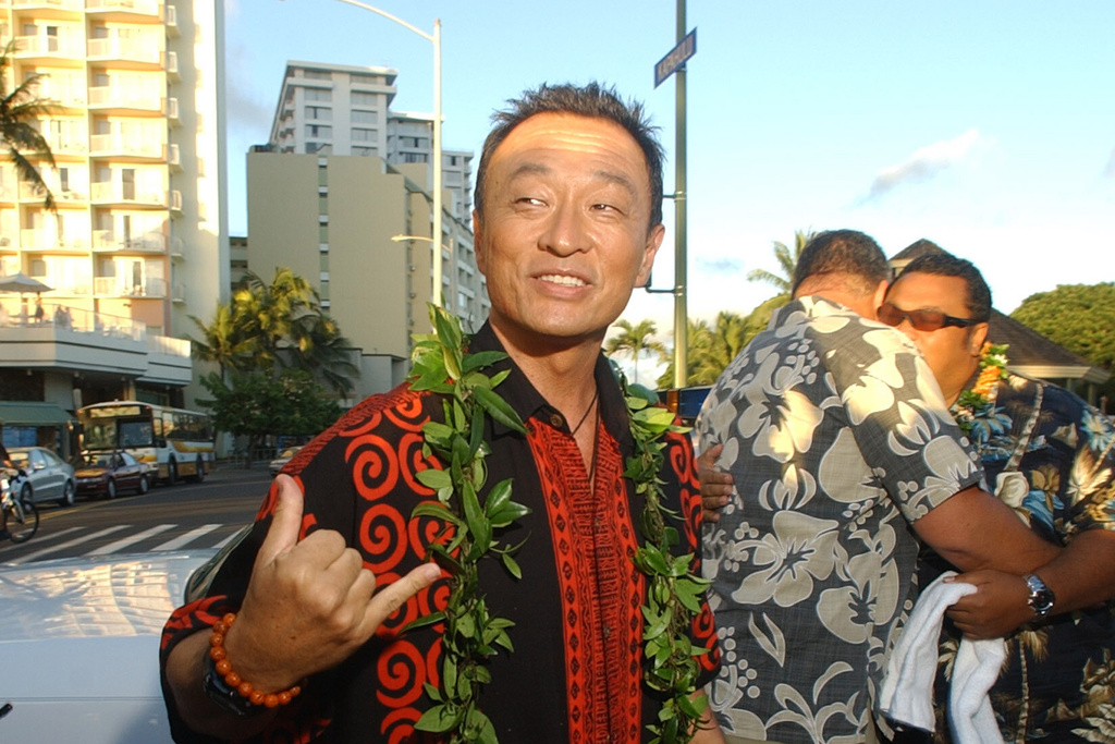 FILE - Cary-Hiroyuki Tagawa gestures after arriving at the world premiere of NBC's new police series "Hawaii" on Waikiki Beach in Honolulu, Hawaii, Aug. 29, 2004, in Honolulu, Hawaii. (AP Photo/Lucy Pemoni, File)