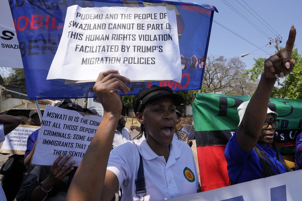 Members of Eswatin Pro-democracy activists, hold placards during their protest outside the U.S. Embassy in Pretoria, South Africa, Friday, Sept. 19, 2025. (AP Photo/Themba Hadebe)
