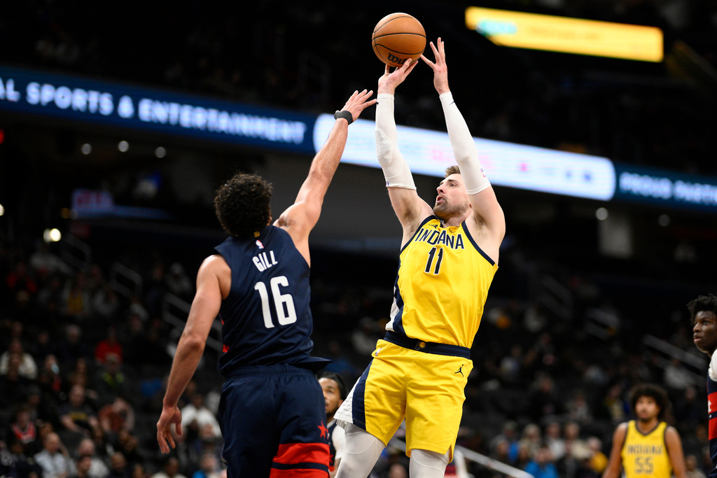 Indiana Pacers center Micah Potter (11) shoots against Washington Wizards forward Anthony Gill (16) during the first half of an NBA basketball game, Thursday, Feb. 19, 2026, in Washington. (AP Photo/Nick Wass)