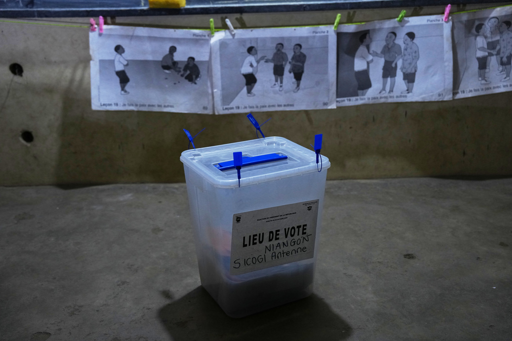 A ballot box is seen in a classroom during the votes count in Yopougon as polls close during the presidential elections in Abidjan, Ivory Coast, Saturday, Oct. 25, 2025. (AP Photo/Misper Apawu)
