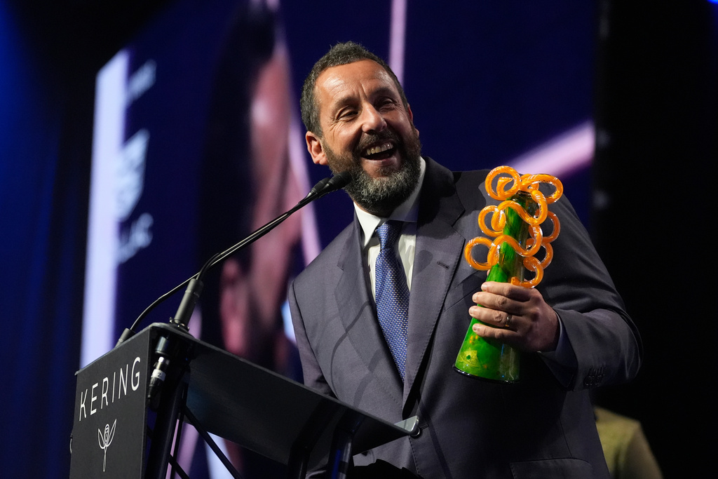 Adam Sandler accepts the chairmans award for "Jay Kelly" during the 37th Palm Springs International Film Festival Film Awards on Saturday, Jan. 3, 2026 at Palm Springs Convention Center in Palm Springs, Calif. (AP Photo/Chris Pizzello)