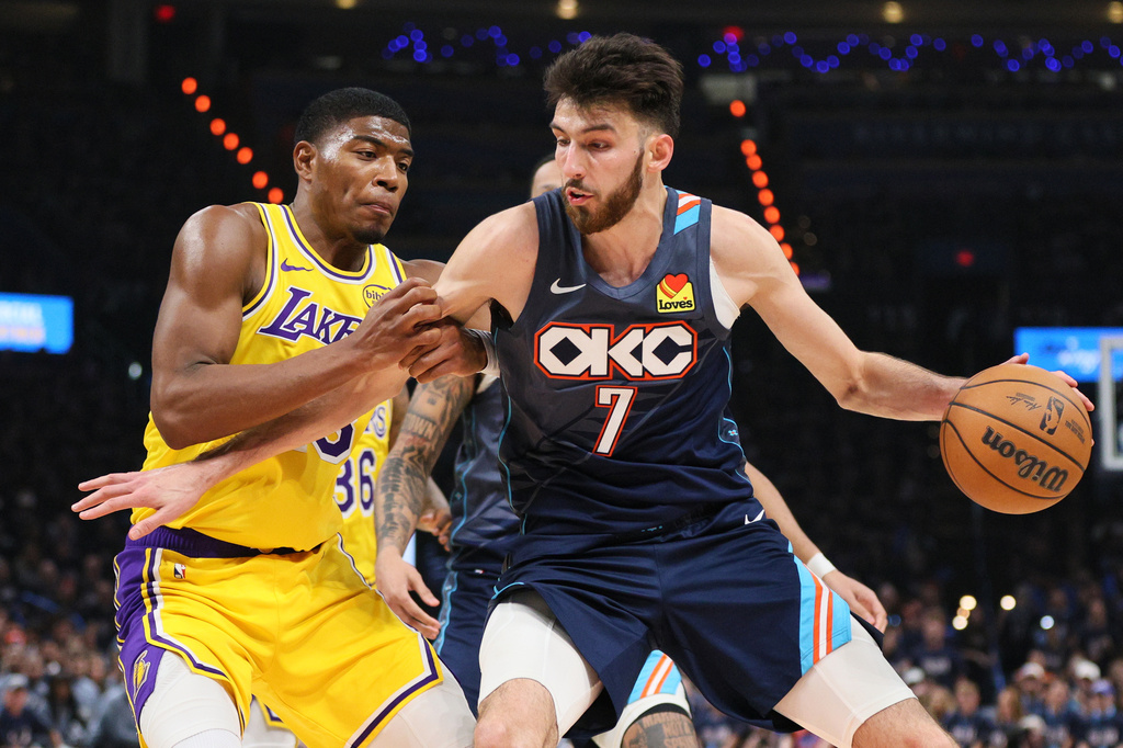 Oklahoma City Thunder center Chet Holmgren (7) works to the basket against Los Angeles Lakers forward Rui Hachimura (28) in the second half of Game 2 in a second-round NBA basketball playoffs series Thursday, May 7, 2026, in Oklahoma City. (AP Photo/Nate Billings)