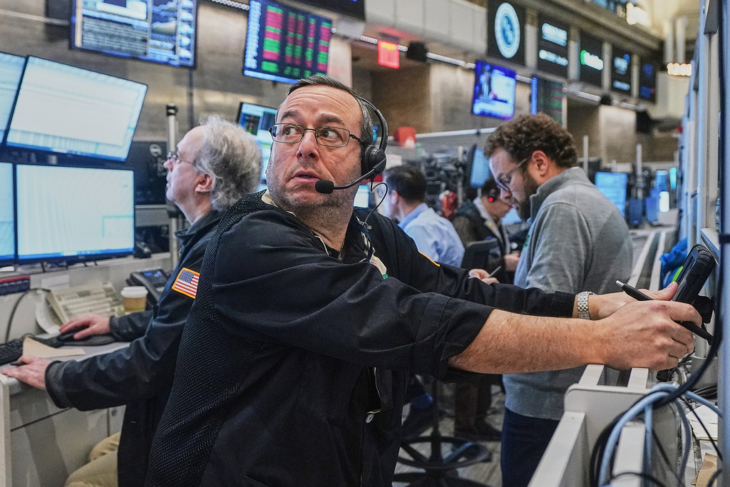 Options trader Matthew Hefter works on the floor of the New York Stock Exchange, Tuesday, Feb. 3, 2026. (AP Photo/Richard Drew)