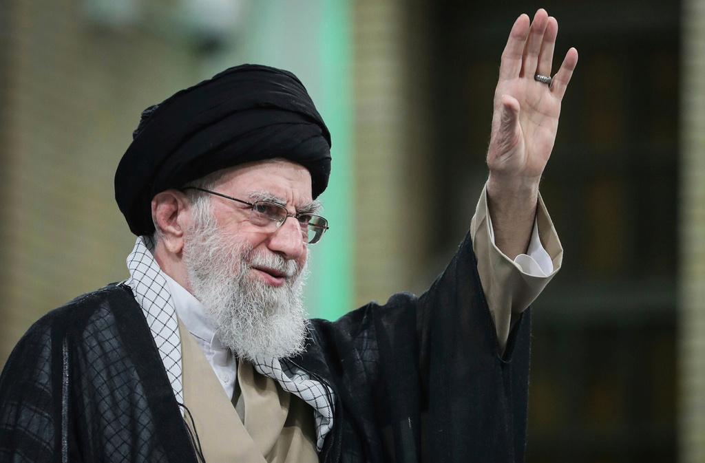 FILE - In this photo released by the official website of the office of the Iranian supreme leader, Supreme Leader Ayatollah Ali Khamenei waves to the crowd during his meeting with a large group of laborers in Tehran, Iran, May 10, 2025. (Office of the Iranian Supreme Leader via AP, File)