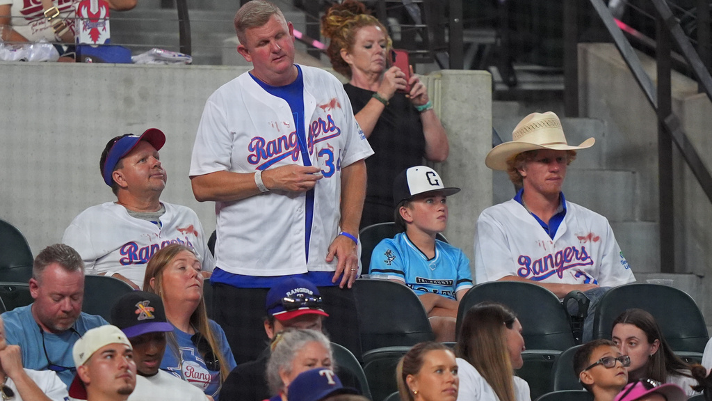 FILE - Texas Rangers fans in the stands wear Nolan Ryan jerseys during a baseball game against the Kansas City Royals, May 29, 2026, in Arlington, Texas. (AP Photo/LM Otero, File)