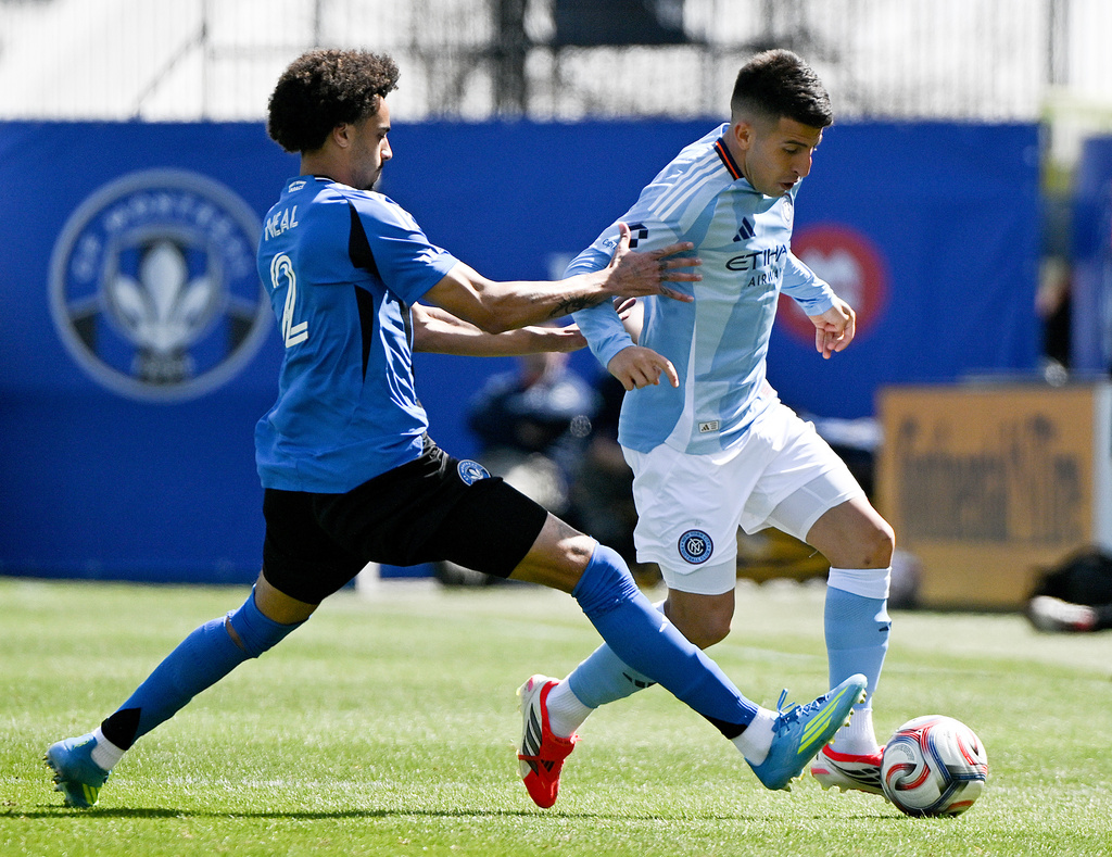 CF Montreal's Jalen Neal (2) battles for the ball with New York City's Nicolas Fernandez (7) during the first half of a MLS soccer game in Montreal, Saturday, April 25, 2026.(Graham Hughes/The Canadian Press via AP)