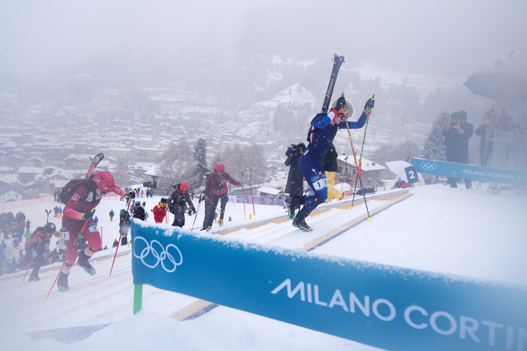 France's Emily Harrop leads during a ski mountaineering women's sprint heat, at the 2026 Winter Olympics, in Bormio, Italy, Thursday, Feb. 19, 2026. (AP Photo/Rebecca Blackwell)