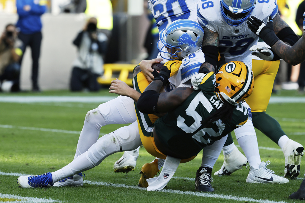 Green Bay Packers defensive end Rashan Gary (52) tackles Detroit Lions quarterback Jared Goff (16) pulling him out of the end zone during the second half of an NFL football game Sunday, Sept. 7, 2025, in Green Bay, Wis. (AP Photo/Mike Roemer)