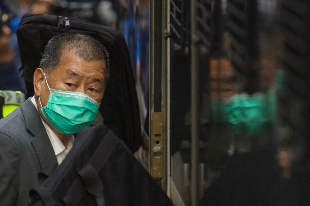 FILE - Democracy advocate Jimmy Lai leaves Hong Kong's Court of Final Appeal where the government is arguing against allowing him bail in Hong Kong, Feb. 1, 2021. (AP Photo/Vincent Yu, File)