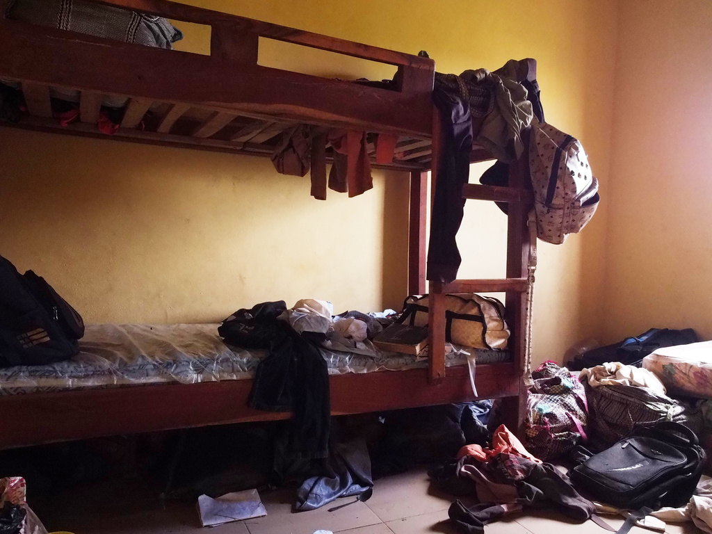 Students' belongings are seen inside a dormitory of an orphanage that was raided by gunmen late Sunday, in Lokoja, Nigeria, Monday, April 27, 2026. (AP Photo/Haruna Yahaya)