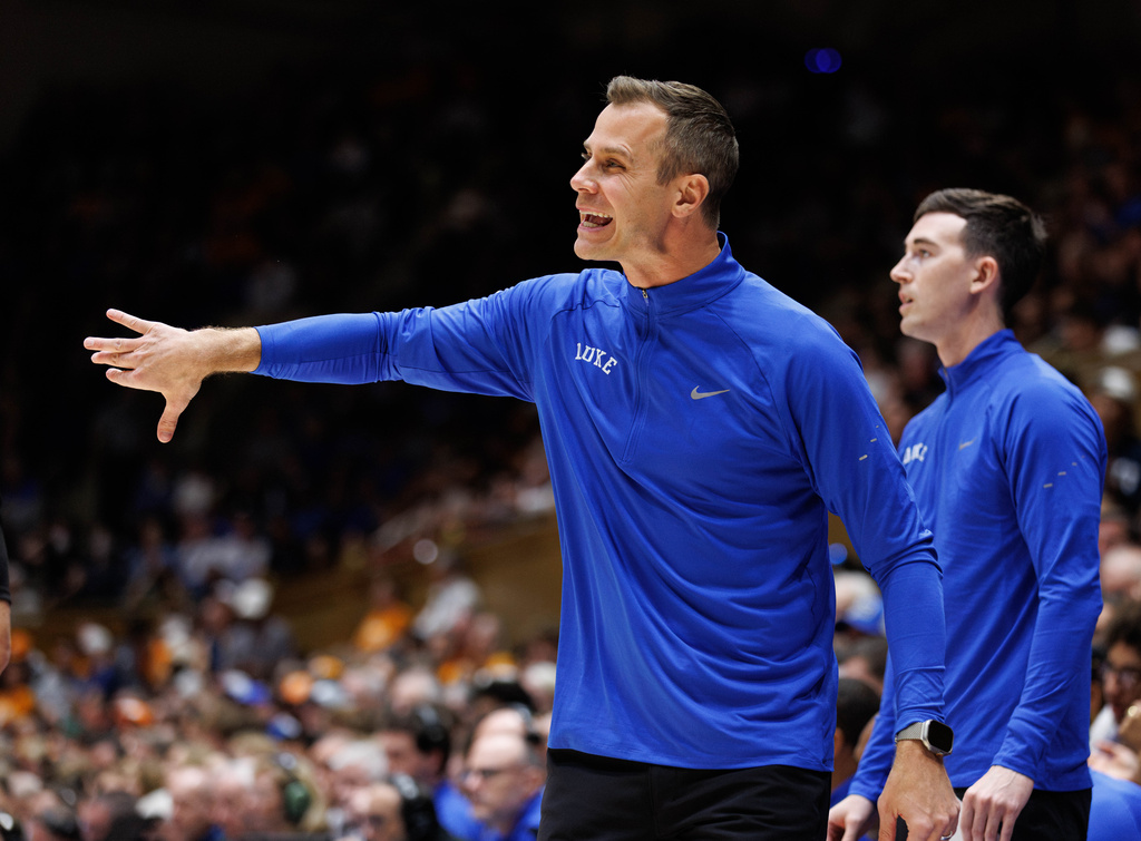 Duke head coach Jon Scheyer directs his team during the first half of an NCAA college basketball game against Tennessee in Durham, N.C., Tuesday, Oct. 20, 2026. (AP Photo/Ben McKeown)