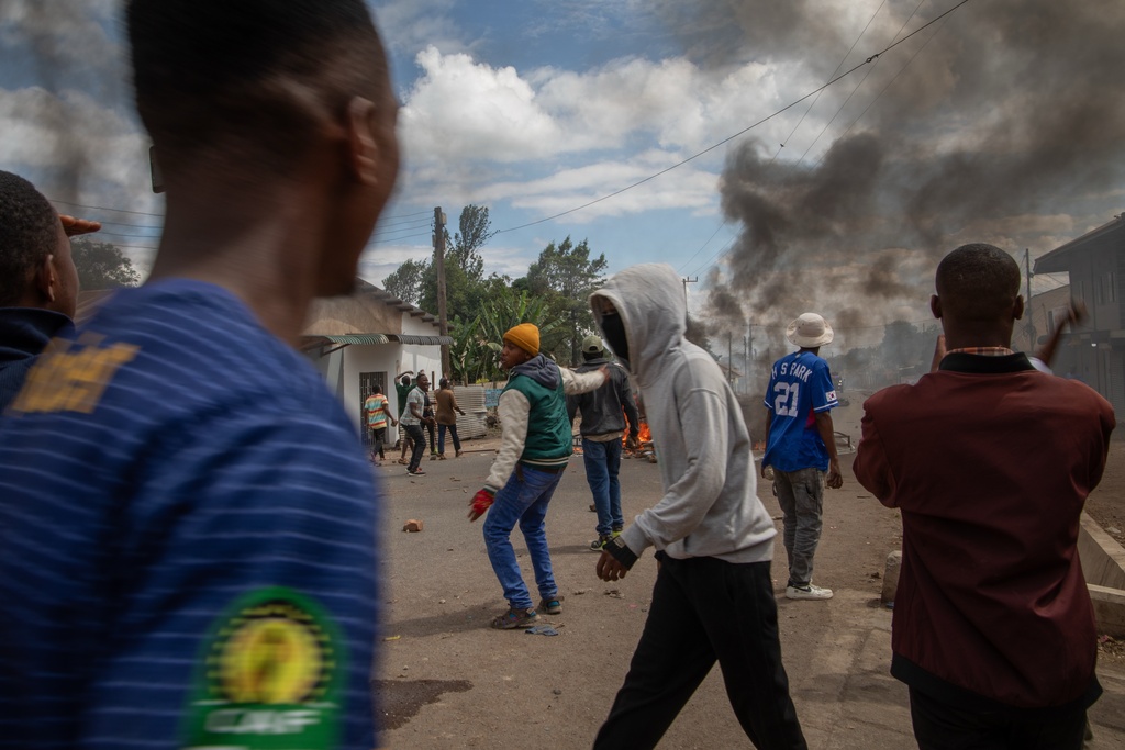 People protest in the streets of Arusha, Tanzania, on election day, Wednesday, Oct. 29, 2025. (AP Photo)