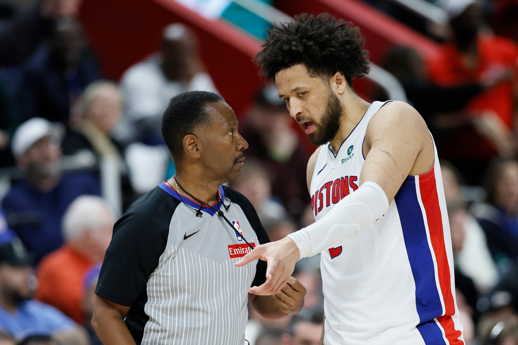 Detroit Pistons guard Cade Cunningham (2) talks with referee James Capers (19) during the first half in Game 1 of a second-round NBA playoffs basketball series against the Cleveland Cavaliers Tuesday, May 5, 2026, in Detroit. (AP Photo/Duane Burleson)