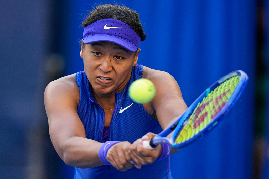 Naomi Osaka, of Japan, returns a ball to Karolina Muchova, of the Czech Republic, during the fourth round of the women's singles match at the China Open tennis tournament in Beijing, Tuesday, Oct. 6, 2026. (AP Photo/Andy Wong)