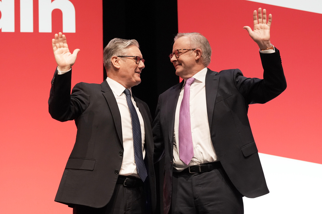 Britain's Prime Minister Keir Starmer and Australian Prime Minister Anthony Albanese, right, attend the Labour Party Conference in Liverpool, England, Sunday Sept. 28, 2025. (Stefan Rousseau/PA via AP)
