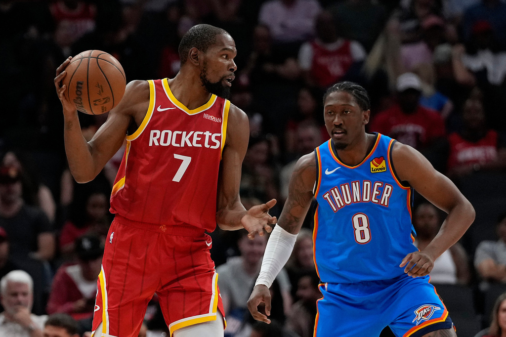 Houston Rockets forward Kevin Durant (7) is defended by Oklahoma City Thunder guard/forward Jalen Williams (8) during the first quarter of a preseason NBA basketball game Thursday, Oct. 15, 2026, in Houston. (AP Photo/Kevin M. Cox)