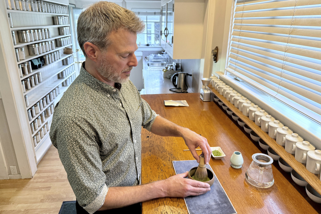 Senior Tea Buyer Aaron Vick uses a whisk to make a matcha drink inside The G.S. Haly Company's tea tasting room in Redwood City, Calif., Wednesday, Sept. 10, 2025. (AP Photo/Haven Daley)