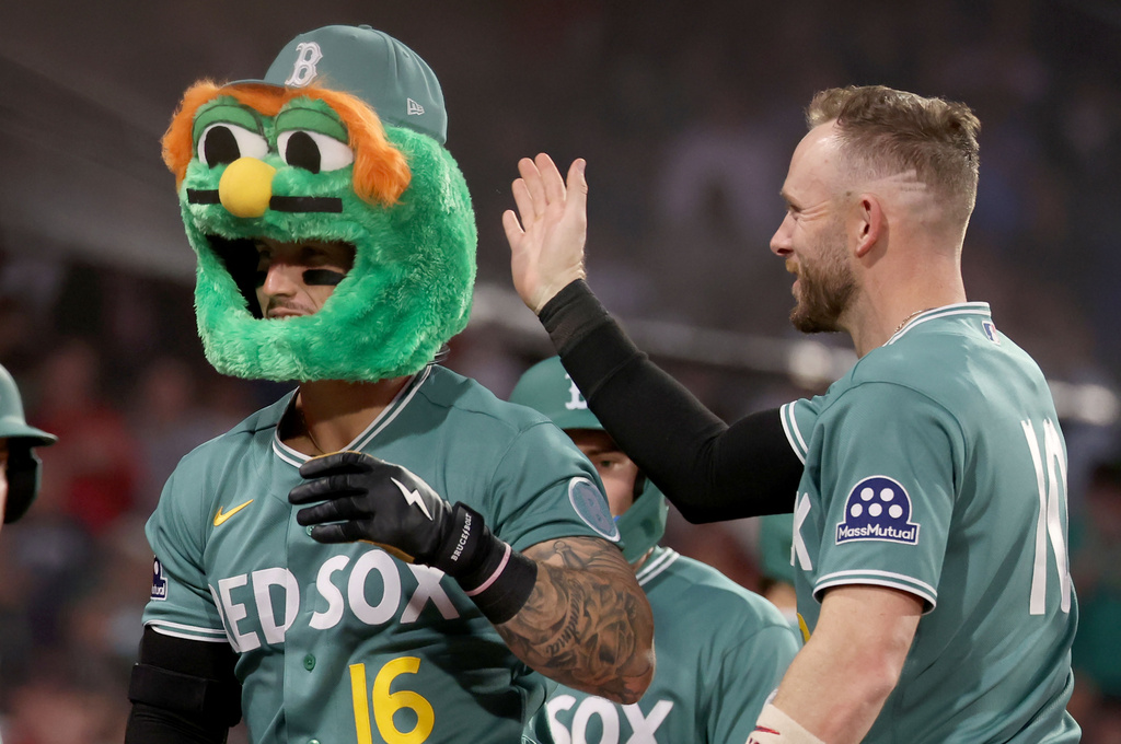 Boston Red Sox's Jarren Duran (16) and Trevor Story, right, celebrate after Duran's three-run home run during the third inning of a baseball game against the Houston Astros, Friday, May 1, 2026, in Boston. (AP Photo/Mark Stockwell)