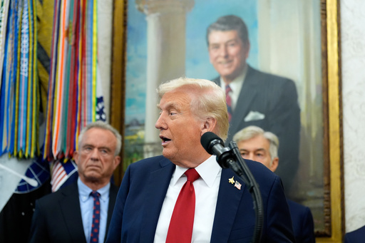 President Donald Trump speaks in the Oval Office of the White House, Tuesday, Sept. 30, 2025, in Washington. Behind the President are Secretary of Health and Human Services Robert F. Kennedy, Jr., left, and Mehmet Oz, Administrator for the Centers for Medicare & Medicaid Services. (AP Photo/Alex Brandon) President Donald Trump speaks in the Oval Office of the White House, Tuesday, Sept. 30, 2025, in Washington. Behind the President are Secretary of Health and Human Services Robert F. Kennedy, Jr., left, and Mehmet Oz, Administrator for the Centers for Medicare & Medicaid Services. (AP Photo/Alex Brandon)