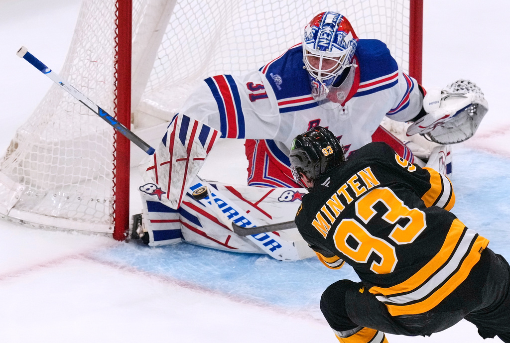 New York Rangers' Igor Shesterkin (31) makes a save on a shot by Boston Bruins' Fraser Minten (93) during the second period of an NHL hockey game, Tuesday, Sept. 29, 2026, in Boston. (AP Photo/Charles Krupa)