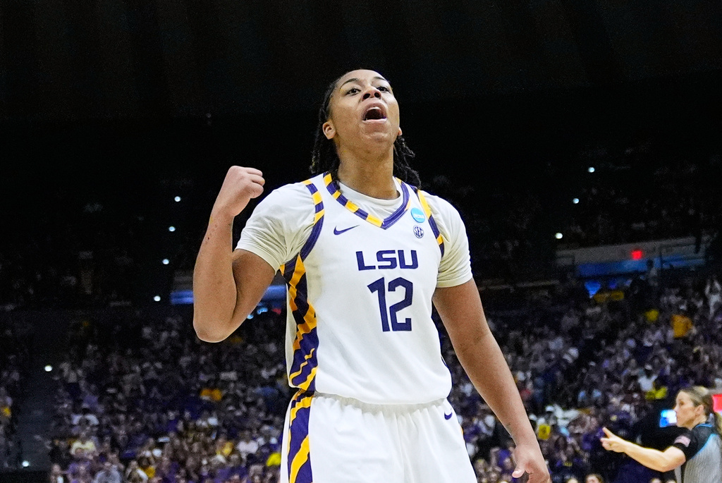 LSU guard Mikaylah Williams (12) celebrates against Texas Tech during the first half in the second round of the NCAA college basketball tournament, Sunday, March 22, 2026, in Baton Rouge, La. (AP Photo/Gerald Herbert)