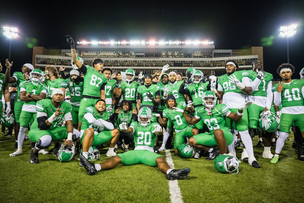 North Texas players celebrate after winning an NCAA college football game against Temple, Friday, Nov. 28, 2025, Denton, Texas. (AP Photo/Jessica Tobias)