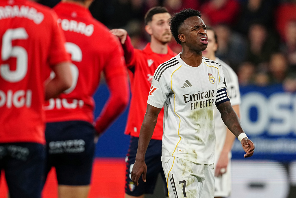 Real Madrid's Vinicius Junior reacts during a Spanish La Liga soccer match between Osasuna and Real Madrid in Pamplona, Spain, Saturday, Feb. 21, 2026. (AP Photo/Miguel Oses)
