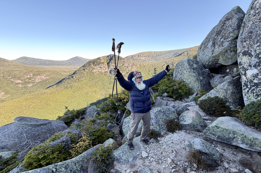 Dale Sanders, 91, celebrates after completing a difficult section of Mt. Katahdin, Monday, Aug. 31, 2026, in Baxter State Park in Piscataquis County, Maine. (AP Photo/Robert F. Bukaty)