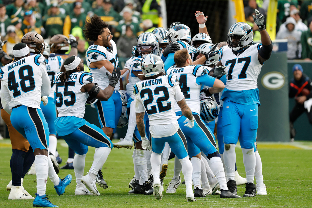 Carolina Panthers punter Sam Martin, second from right, and placekicker Ryan Fitzgerald (10) celebrate with teammates after the winning field goal against the Green Bay Packers in an NFL football game Sunday, Nov. 2, 2025, in Green Bay, Wis. (AP Photo/Mike Roemer)
