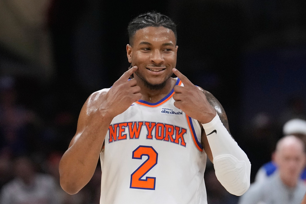 New York Knicks guard Miles McBride reacts during the second half of Game 4 in the Eastern Conference finals NBA basketball playoffs series against the Cleveland Cavaliers in Cleveland, Monday, May 25, 2026. (AP Photo/Sue Ogrocki)