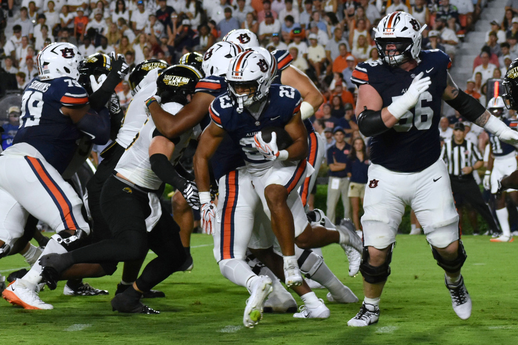 Auburn Running Back Jeremiah Cobb pushes through against Southern Miss defenders during an NCAA College Football game Saturday, Sept. 12, 2026 in Auburn, Al. (Aimee Cronan/The Gazebo Gazette via AP)