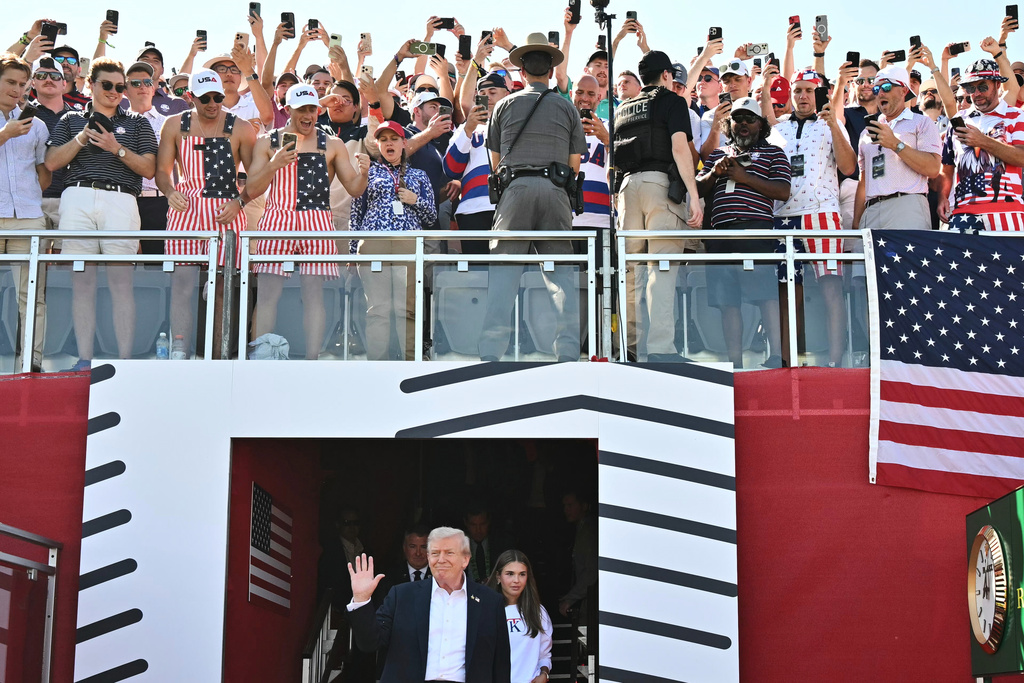 FILE - President Donald Trump, left, and his granddaughter Kai Trump attend the Ryder Cup golf tournament at Bethpage Black Golf Course in Farmingdale, N.Y., Friday, Sept. 26, 2025. (Mandel Ngan/Pool Photo via AP, File)