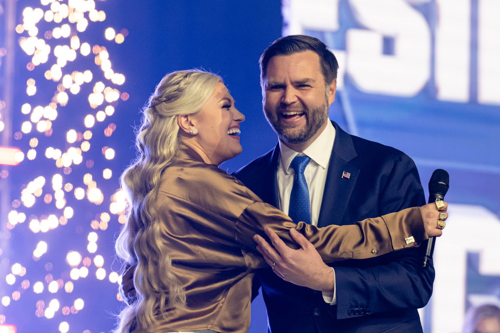 Erika Kirk greets Vice President JD Vance during Turning Point USA's AmericaFest 2025, Sunday, Dec. 21, 2025, in Phoenix. (AP Photo/Jon Cherry)