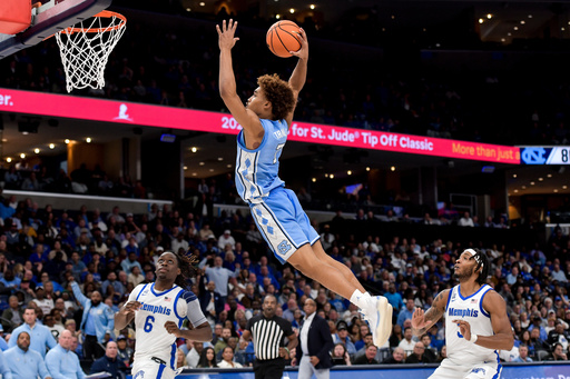 FILE - North Carolina guard Seth Trimble (7) dunks against Memphis during the Hoops for St. Jude Tip Off Classic NCAA college basketball exhibition game Tuesday, Oct. 15, 2024, in Memphis, Tenn. (AP Photo/Brandon Dill, File) FILE - North Carolina guard Seth Trimble (7) dunks against Memphis during the Hoops for St. Jude Tip Off Classic NCAA college basketball exhibition game Tuesday, Oct. 15, 2024, in Memphis, Tenn. (AP Photo/Brandon Dill, File)