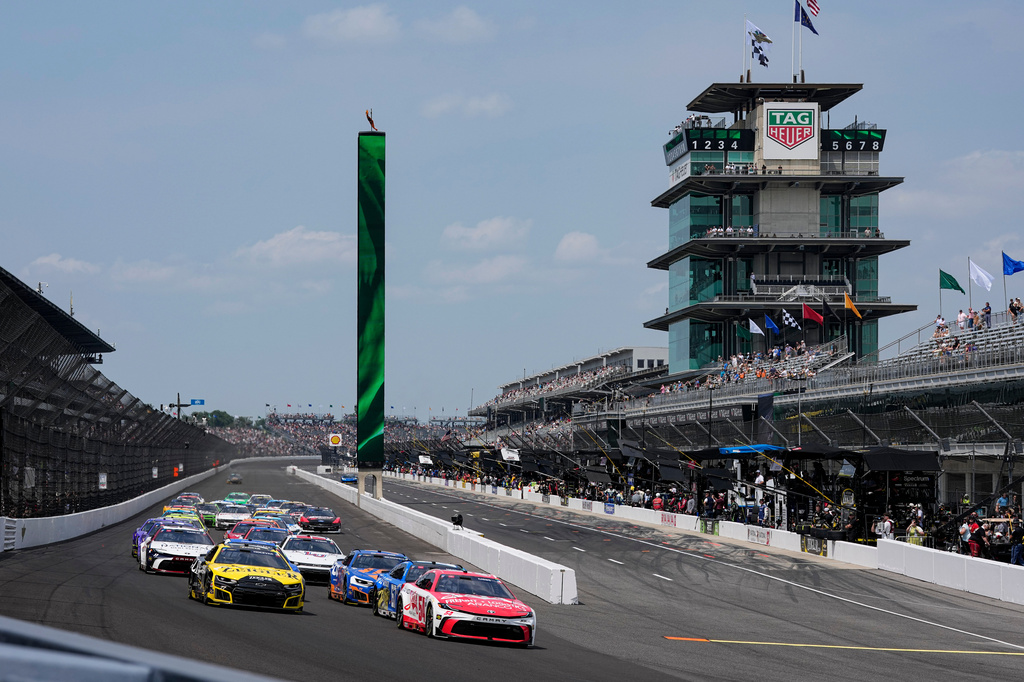Ty Gibbs (54) leads the field on a restart during the NASCAR Cup Series auto race at Indianapolis Motor Speedway in Indianapolis, Sunday, July 26, 2026. (AP Photo/Michael Conroy)