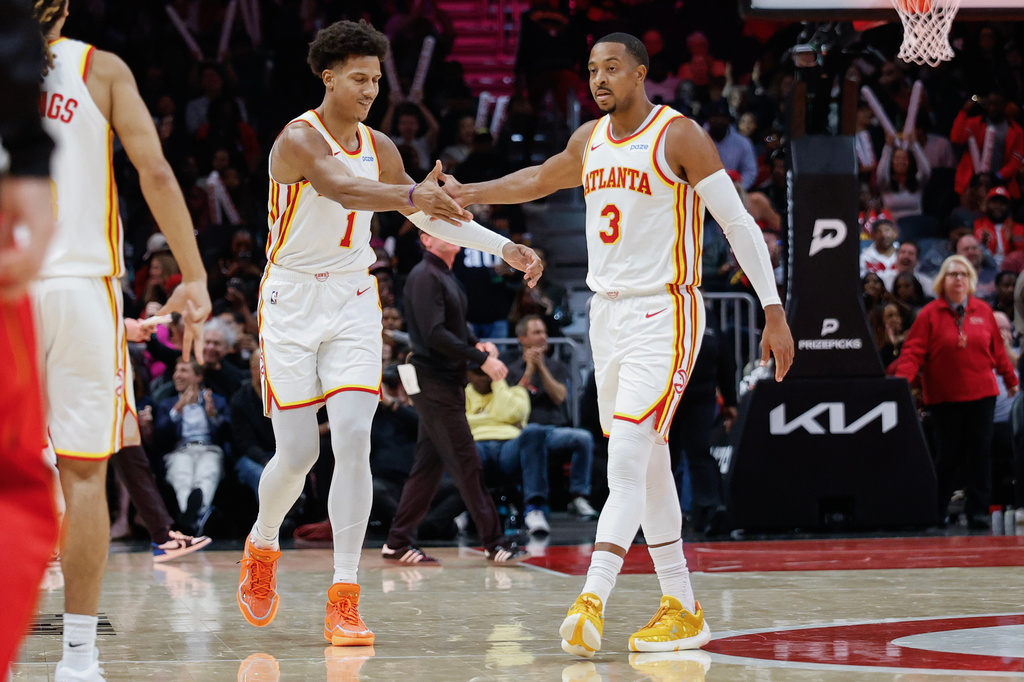 Atlanta Hawks forward Jalen Johnson (1) reacts with guard CJ McCollum (3) during a timeout during the second half of an NBA basketball game against the Cleveland Cavaliers, Thursday, Oct. 29, 2026, in Atlanta. (AP Photo/Erik S. Lesser)