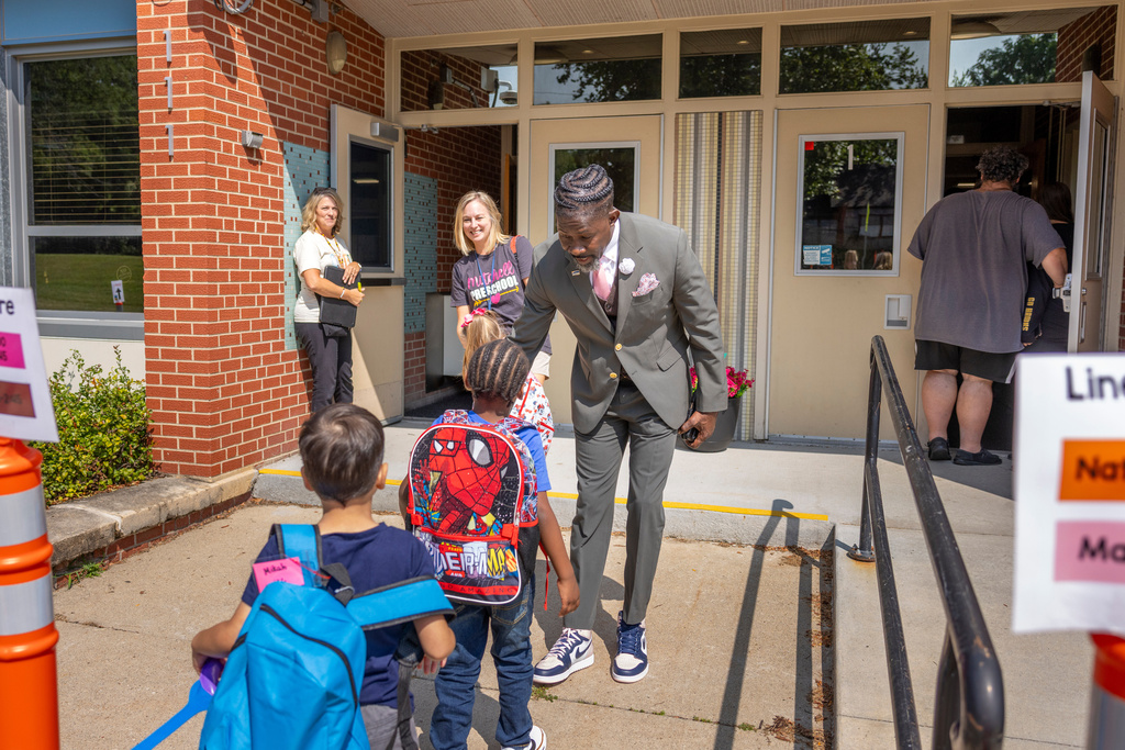 Ian Roberts, superintendent of Des Moines Public Schools, greets students at Mitchell Early Learning Center in Des Moines, Iowa, Sep. 6, 2025. (Jon Lemons/Des Moines Public Schools via AP)