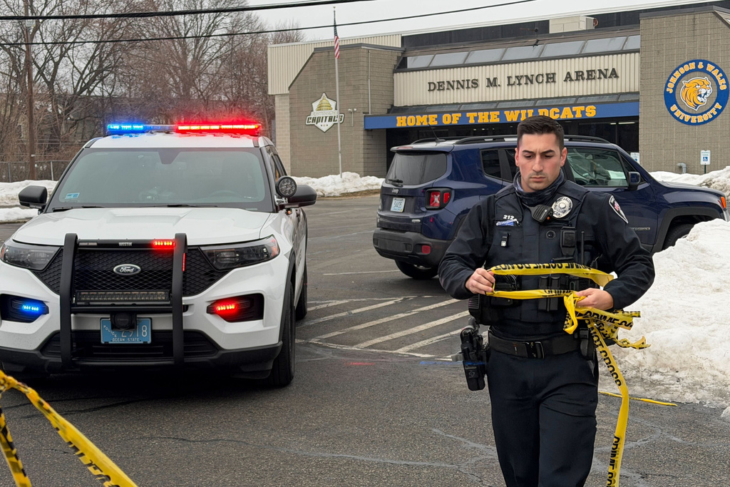 Police continue to tape off the Dennis M. Lynch arena a day after a deadly shooting during a youth hockey game on Tuesday, Feb. 17, 2026 in Pawtucket, R.I. (AP Photo/Rodrique Ngowi)