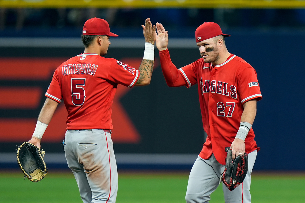 Los Angeles Angels' Mike Trout (27) celebrates with Vaughn Grissom (5) after the team defeated the Tampa Bay Rays during a baseball game Saturday, May 30, 2026, in St. Petersburg, Fla. (AP Photo/Chris O'Meara)